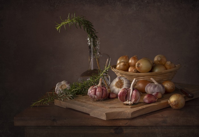 Still life with garlic, onions, rosemary, and jug