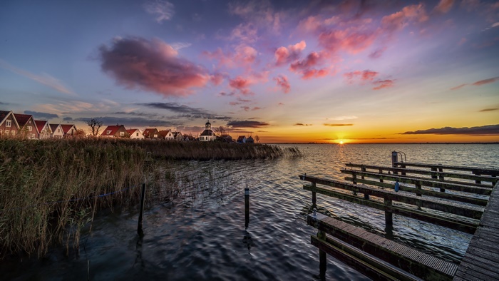 Village by the lake at sunset