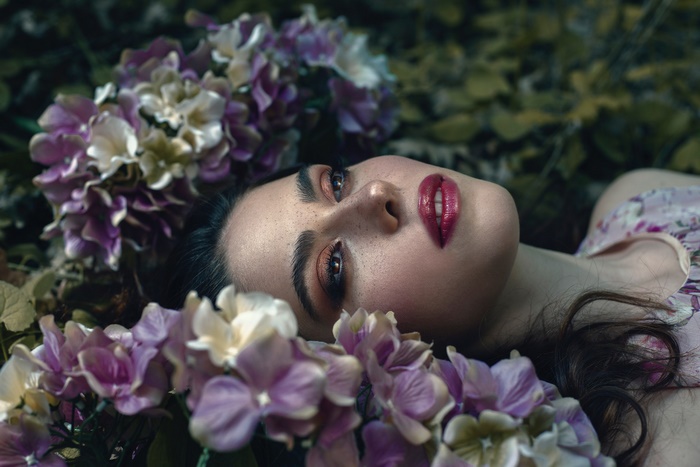 Woman with flowers and makeup