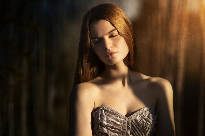 Woman with long hair wearing a corset