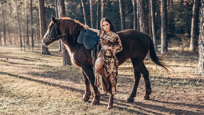 Woman Posing with Horse in Forest