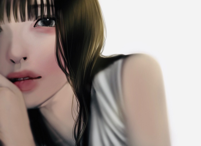 Close-up of a young woman's face with bangs