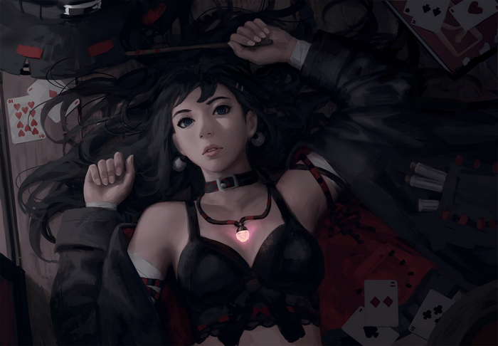 Girl lying down with playing cards
