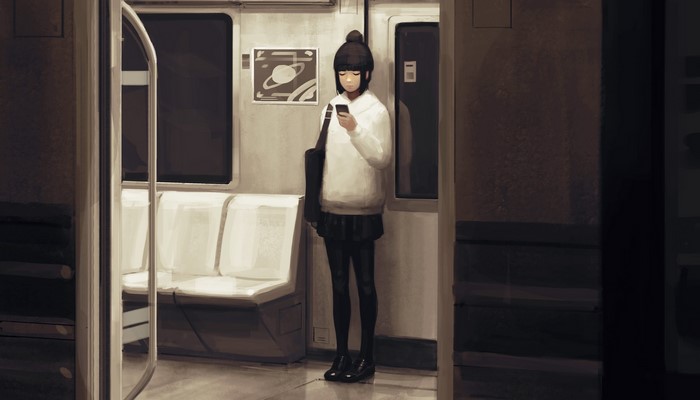 Girl on a train looking at her phone