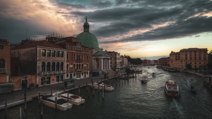 Venice Canal at Dusk with Boats and Buildings