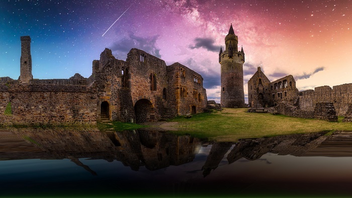 Ruined Castle Under Starry Sky with Reflection