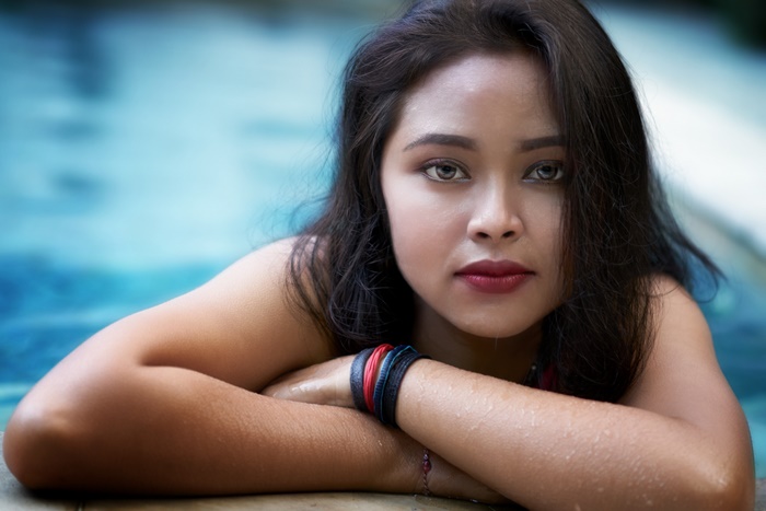 Woman with dark hair in a pool