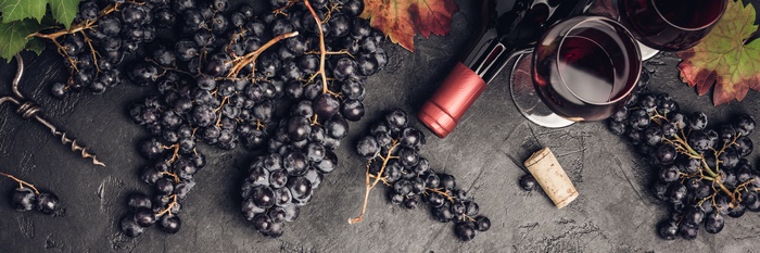 Grapes and Red Wine Bottle with Glasses