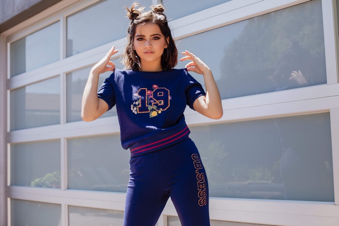 Isabela Moner in a blue tracksuit