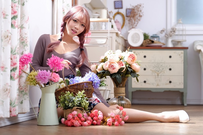 Asian Woman with Braids and Flowers