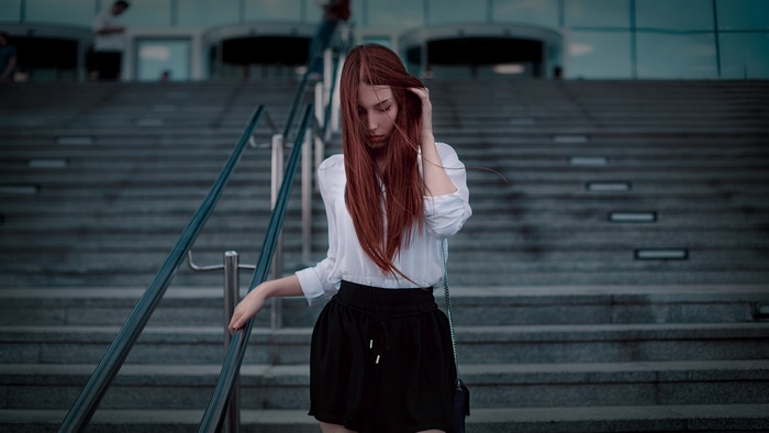 Redhead woman on stairs