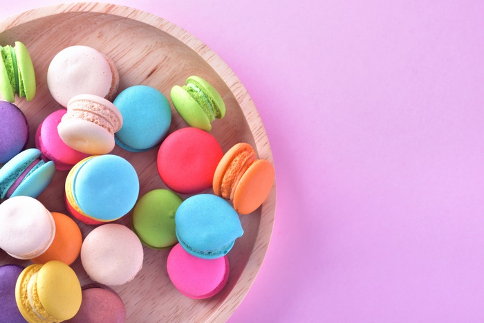Colorful Macarons on a Wooden Plate
