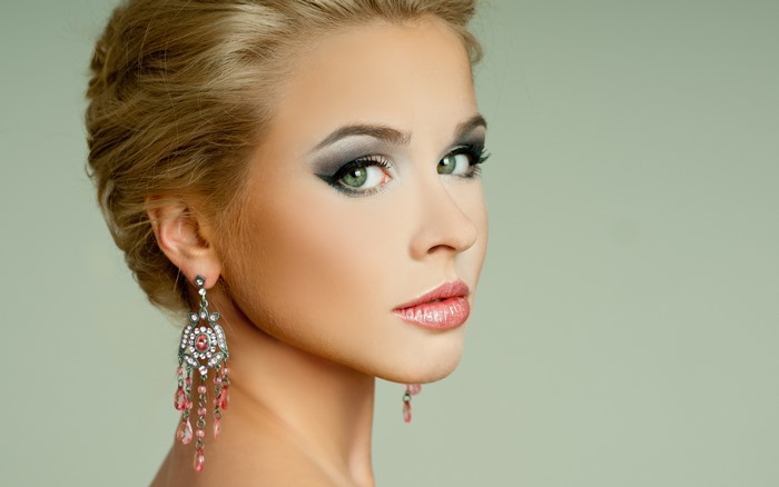 Blonde Model with Green Eyes and Elegant Makeup
