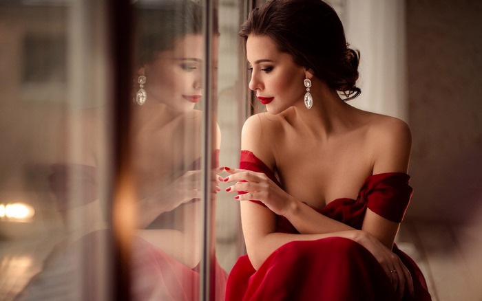 Elegant Woman in Red Dress with Earrings