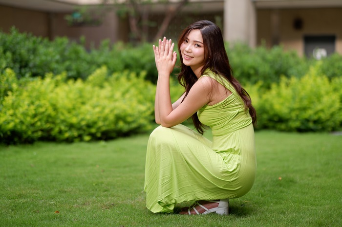 Asian Woman in Green Dress Smiling