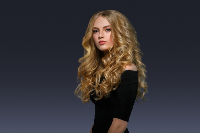 Blonde Woman with Curly Hair and Makeup