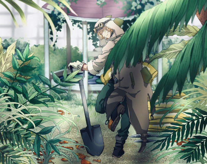 Boy with shovel in a greenhouse