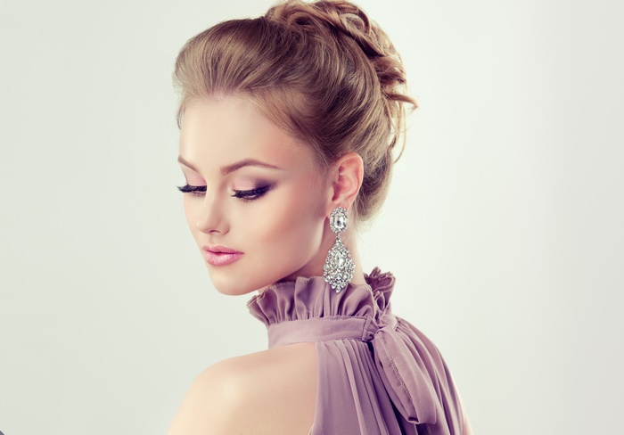 Elegant Woman with Diamond Earrings and Updo in 4K