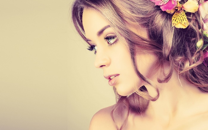 Woman with flowers in her hair and makeup