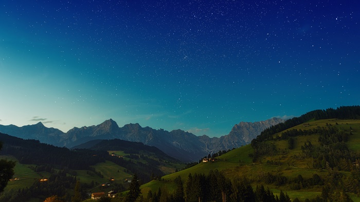 Mountain landscape with stars and houses