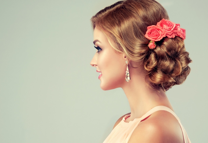 Elegant Woman with Rose Hair Accessory 4K