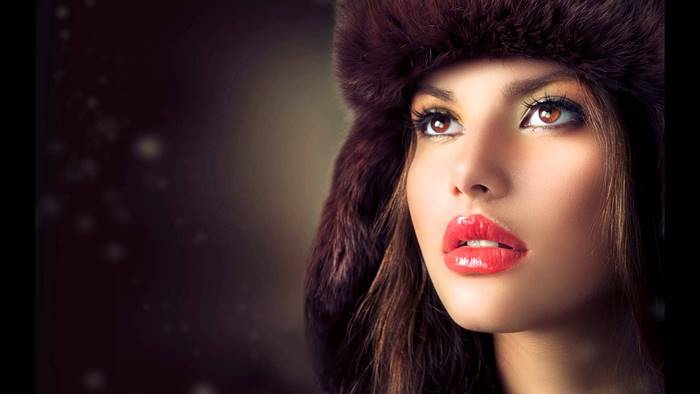 Woman wearing a fur hat with red lipstick