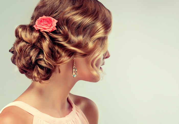 Woman with Rose in Hair and Earrings