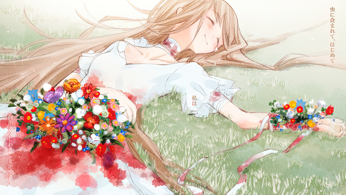 Girl in white dress lying in grass with flowers