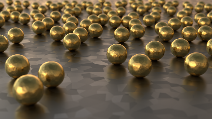 Gold Marbles on a Textured Surface