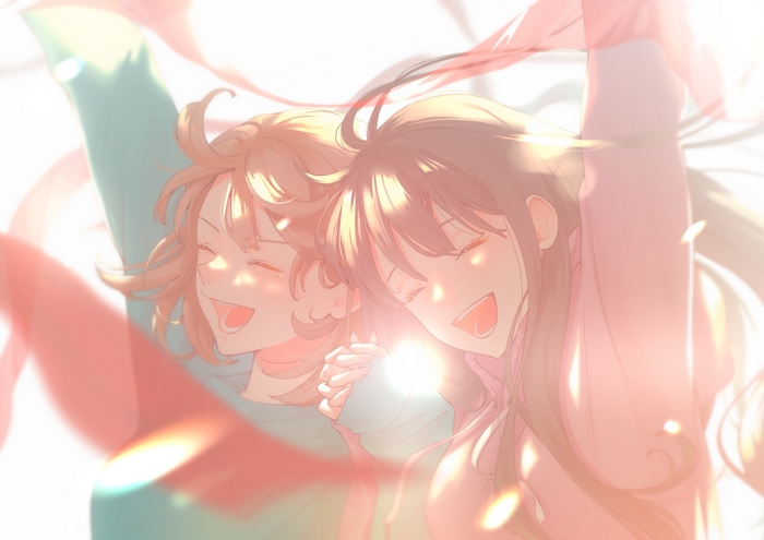 Two girls smiling with arms raised