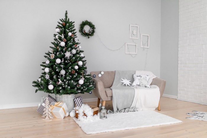 Christmas tree with gifts and sofa