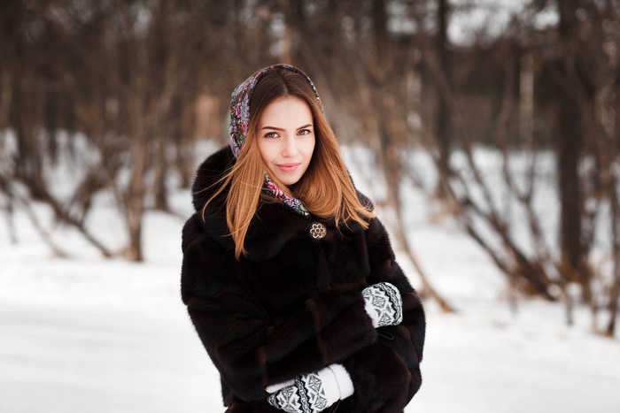 Woman in fur coat and headscarf in winter