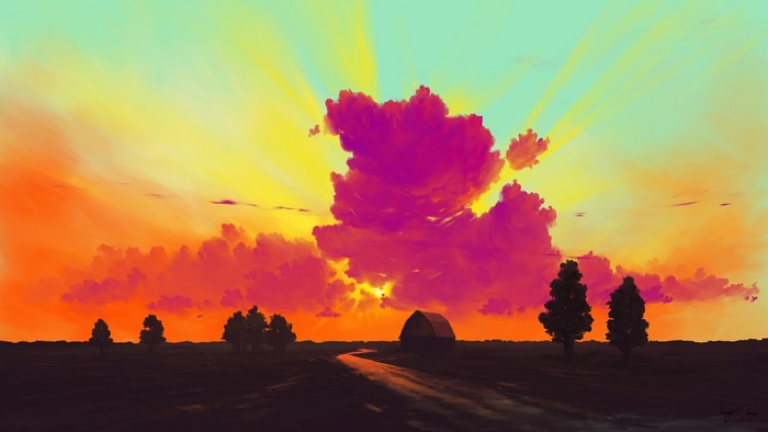 Dramatic sunset over a rural landscape with a barn