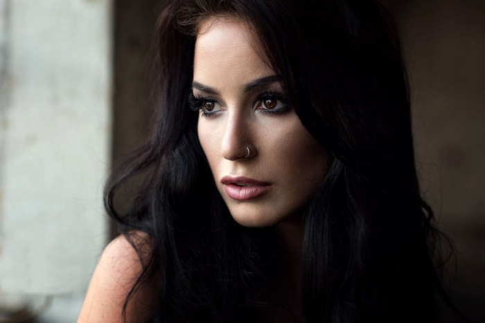 Woman with black hair and brown eyes