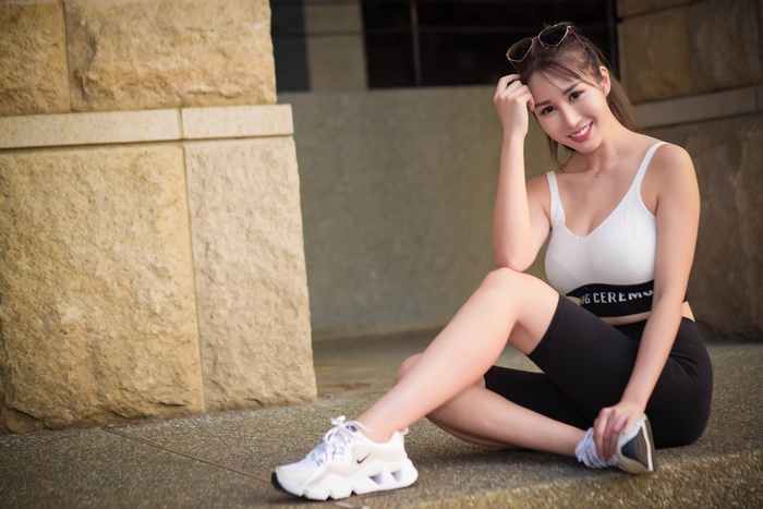 Asian Woman Smiling in Athletic Wear