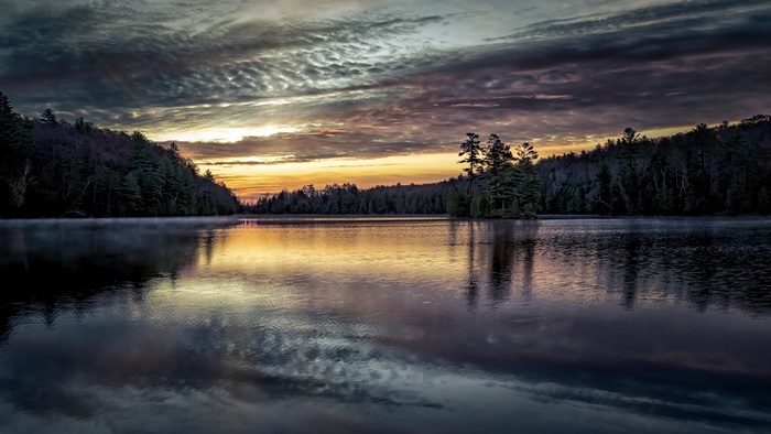 Lake at Sunset with Forest and Clouds