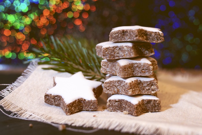 Star-shaped cookies with icing and pine branch