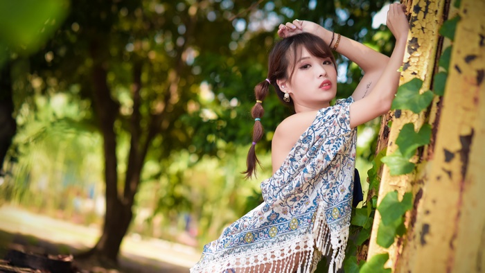 Asian Model with Brunette Hair in a Garden