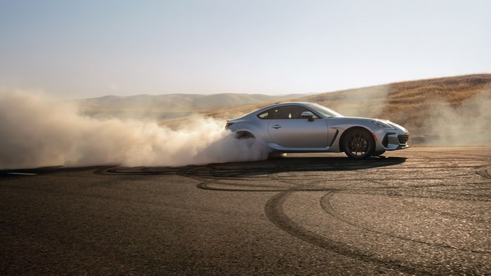 Silver Subaru BRZ drifting in smoke