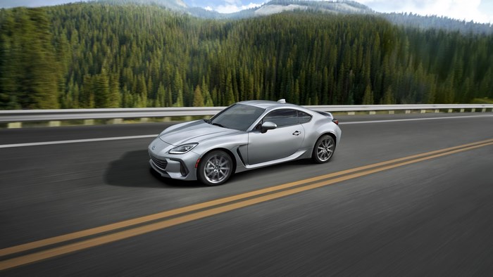 Silver Subaru BRZ driving on a mountain road