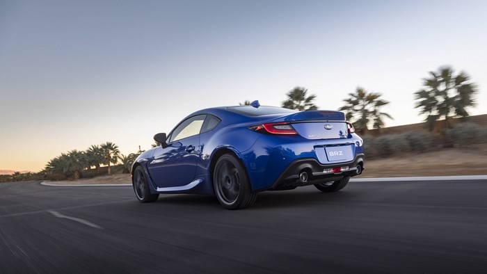 Blue Subaru BRZ driving on a road
