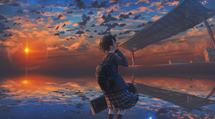 Girl with backpack under sunset sky