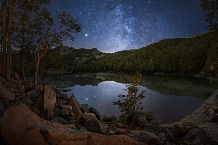 Lago Santo at night with the Milky Way over mountains