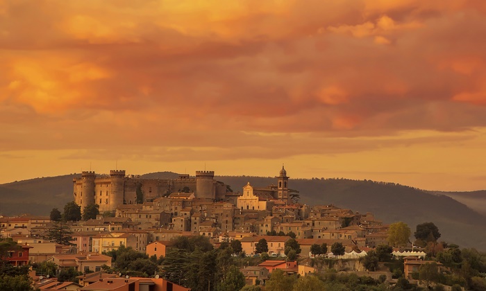 Castle and town in Bracciano, Italy at sunset
