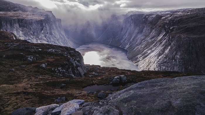 Lake in a Fjord with Rocky Cliffs
