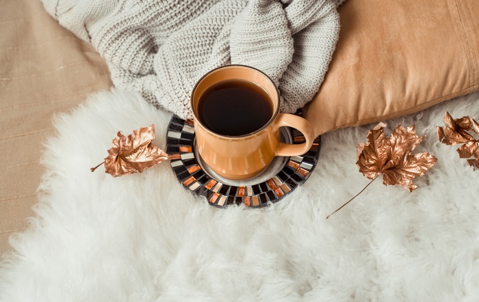 Cup of Coffee with Autumn Leaves