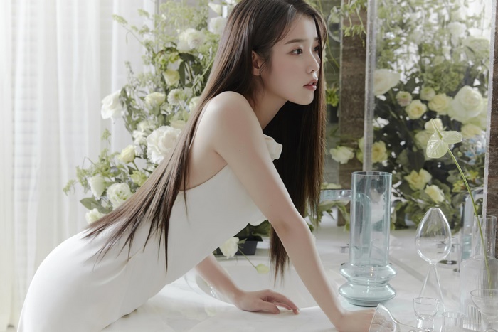 IU in a white dress with flowers