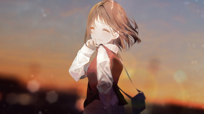 Girl with short brown hair smiling at sunset
