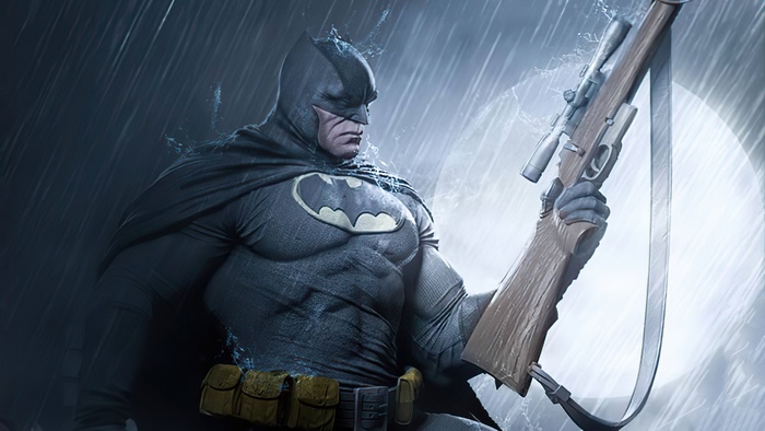 Batman holding a sniper rifle in the rain