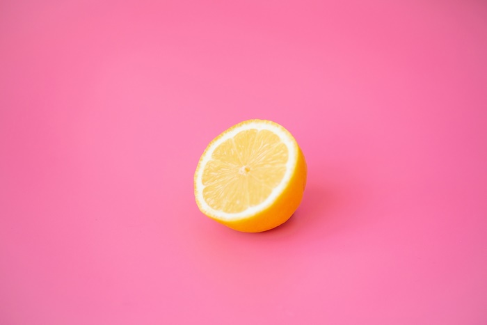 Half Lemon on Pink Background
